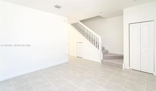 an entryway with staircase