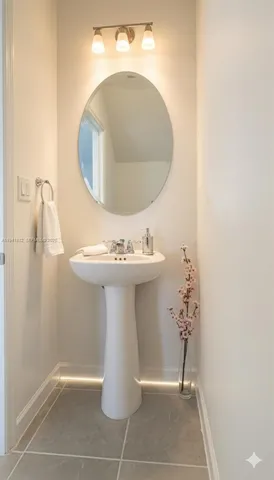 a kitchen with stainless steel appliances a refrigerator sink and white cabinets
