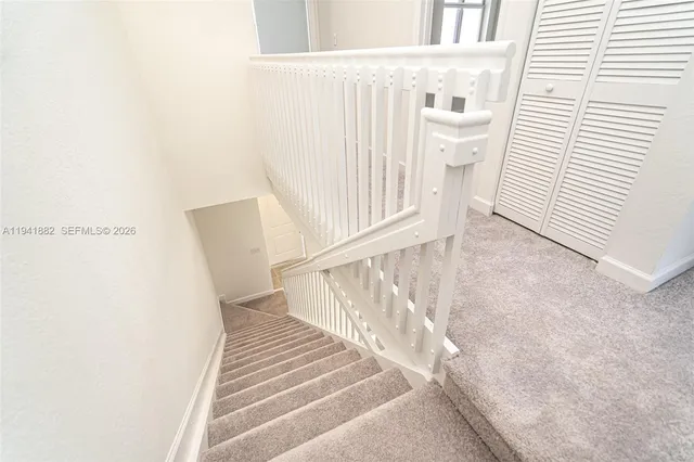 a view of a white house and white walls