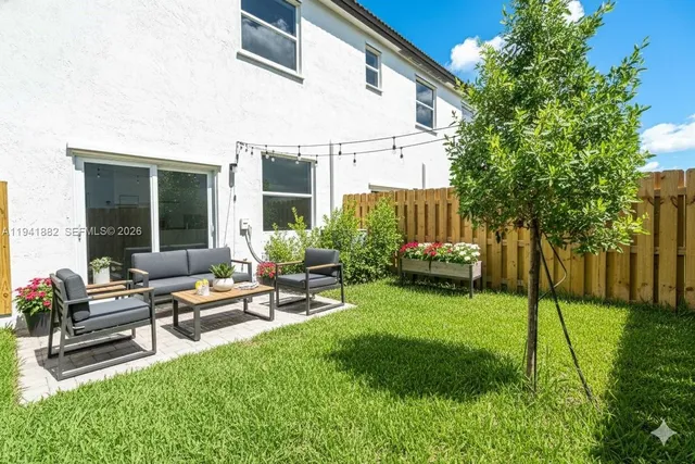 a view of a backyard with a patio