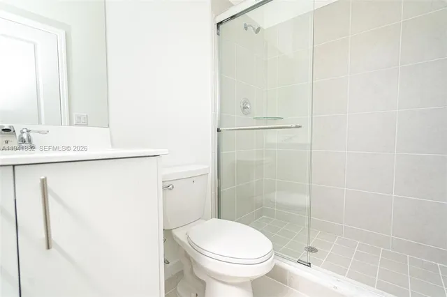 a bedroom with a bed and chair