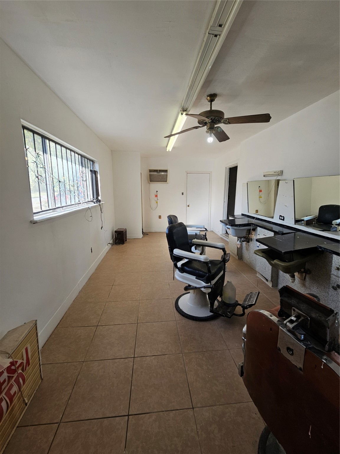 5703 Belneath Street Houston, TX 77033 - Photo 15 of 21 a living room with furniture a air conditioner and a window
