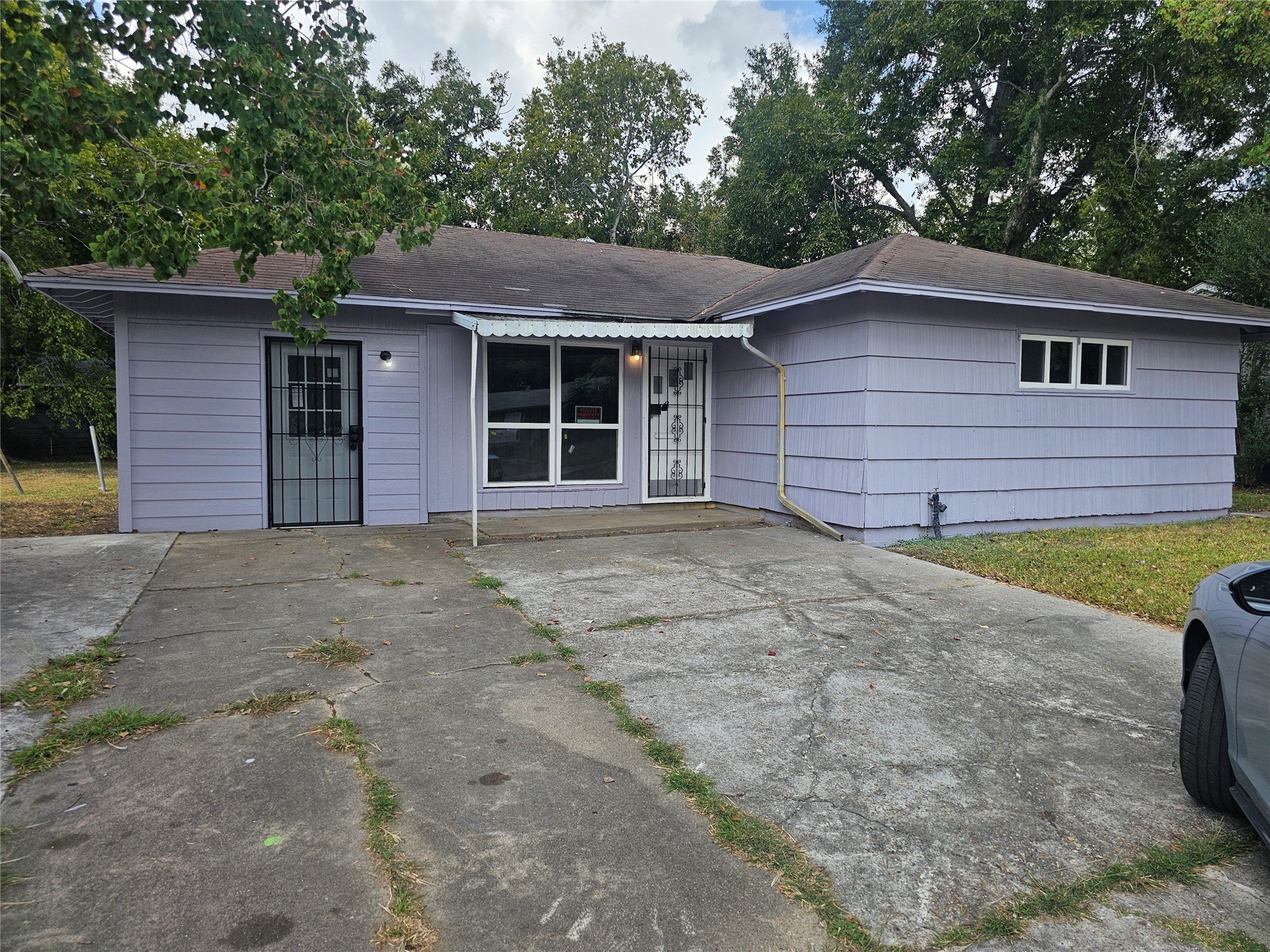 5703 Belneath Street Houston, TX 77033 - Photo 17 of 21 a view of a house with a yard