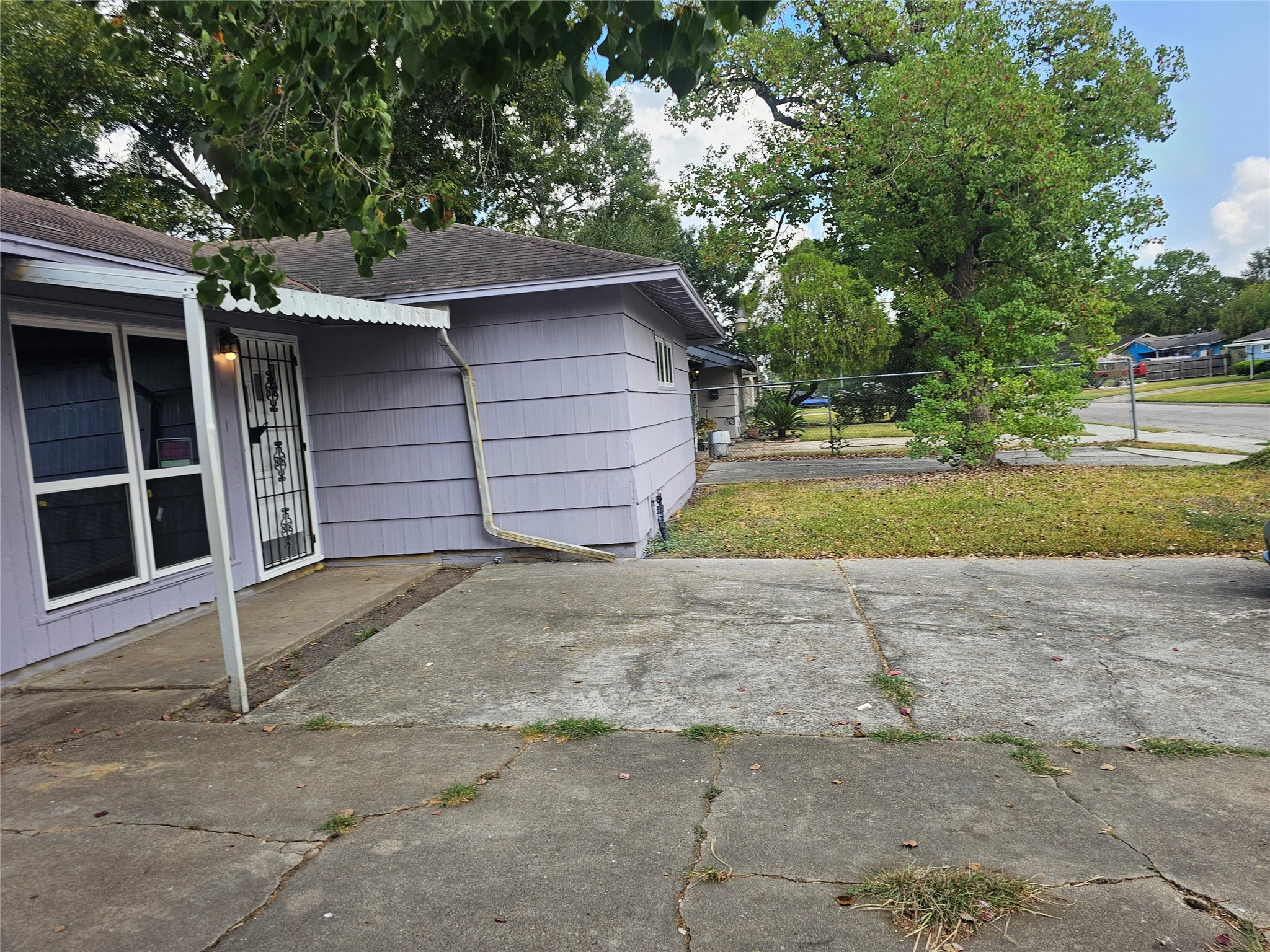 5703 Belneath Street Houston, TX 77033 - Photo 20 of 21 a house with a yard and garage