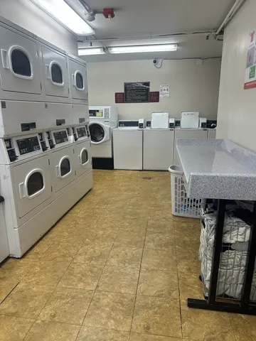 a kitchen with stainless steel appliances a stove a sink and a refrigerator