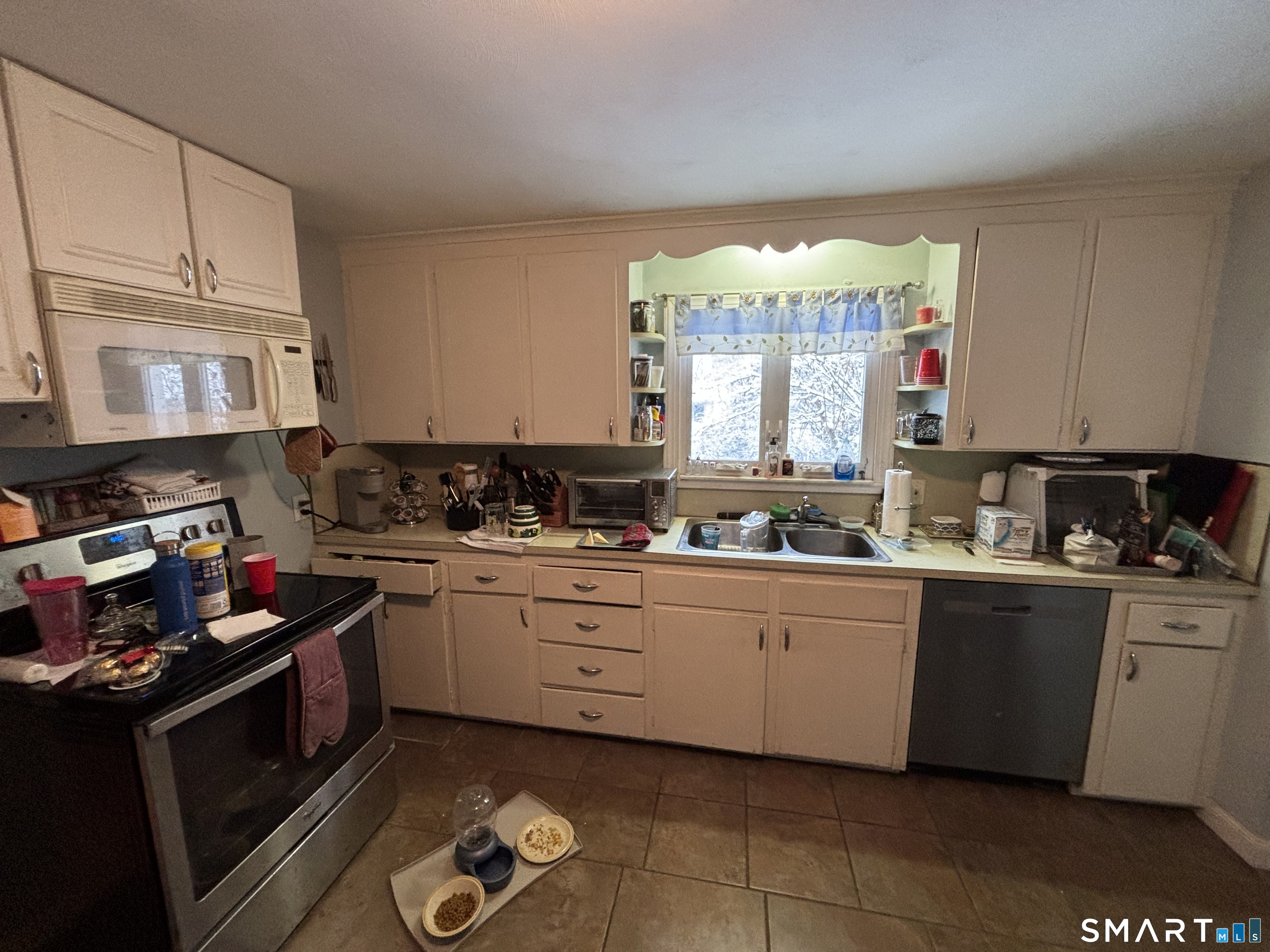 519 Prospect Street Wethersfield, CT 06109 - Photo 5 of 24 a kitchen with a cabinets window and appliances