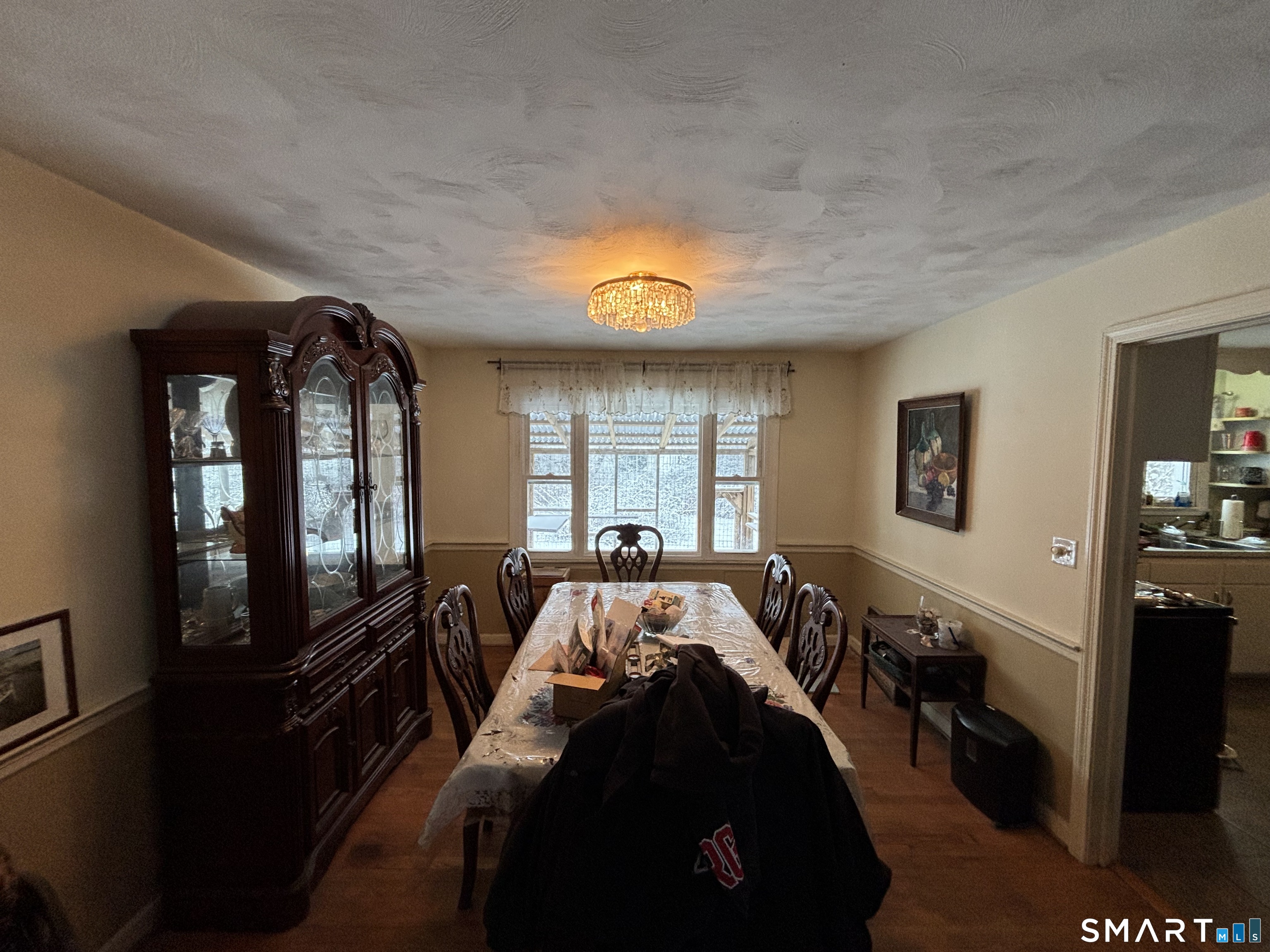 519 Prospect Street Wethersfield, CT 06109 - Photo 8 of 24 a bed sitting in a bedroom next to a window