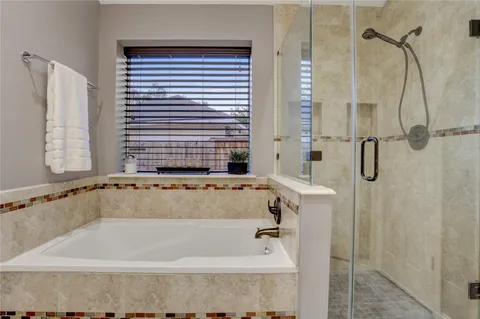 a bath tub sitting next to a window