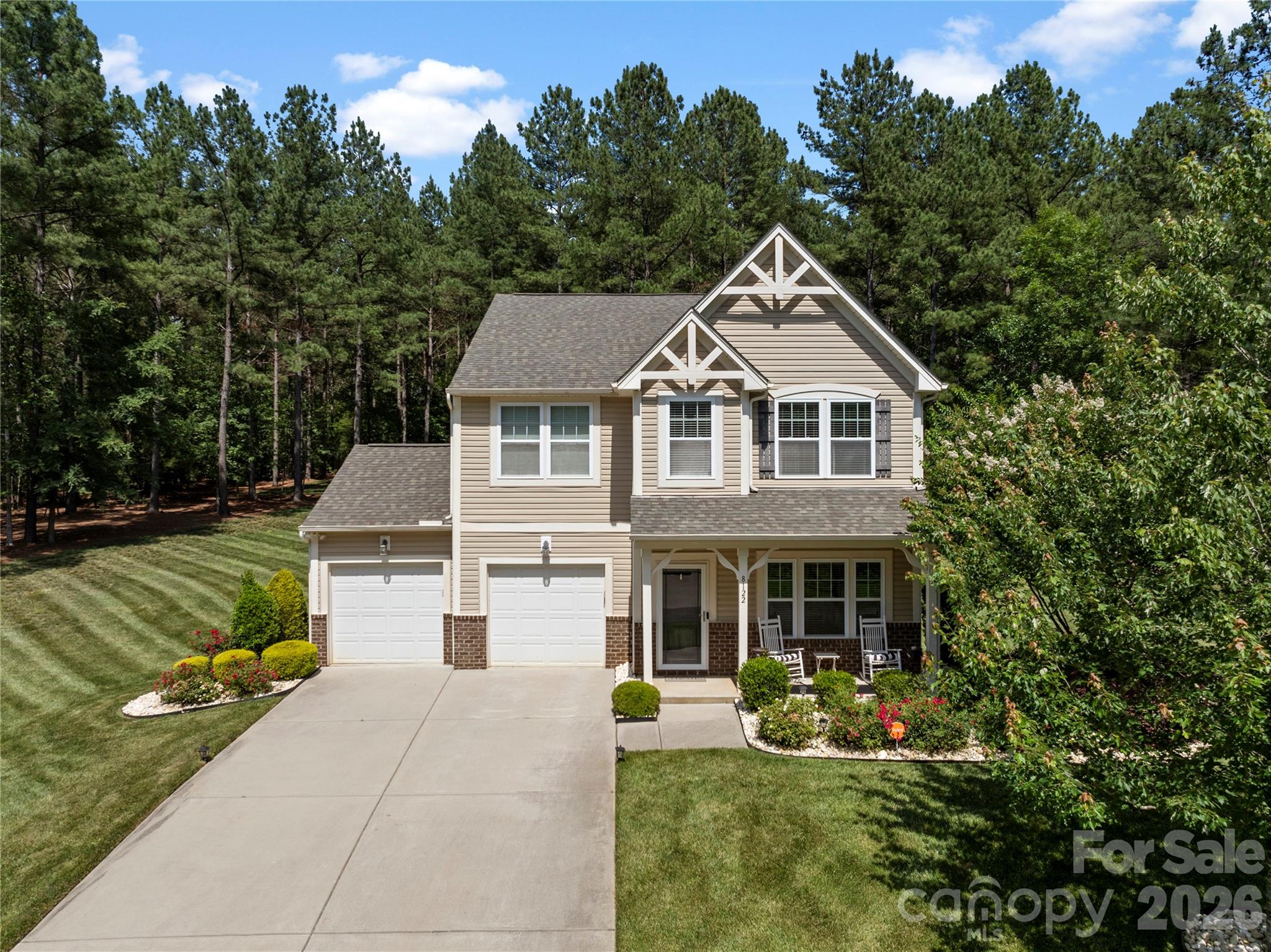 8122 Mossy Rock Road Waxhaw, NC 28173 - Photo 1 of 28 a front view of a house with a yard