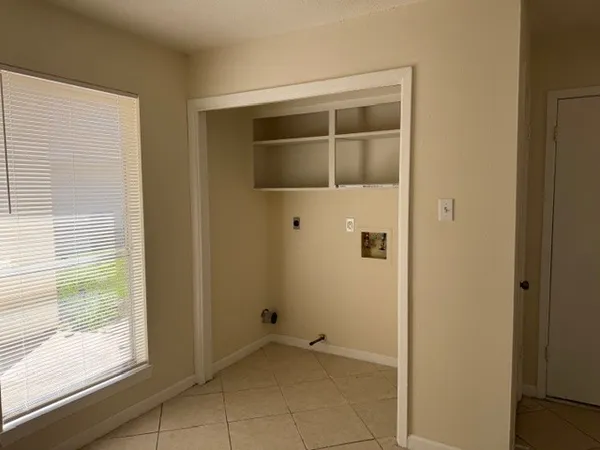 a view of an empty room with a window