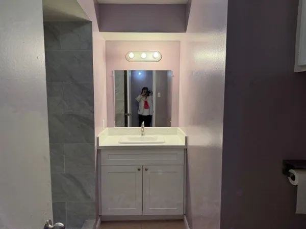 a bathroom with a sink and a mirror