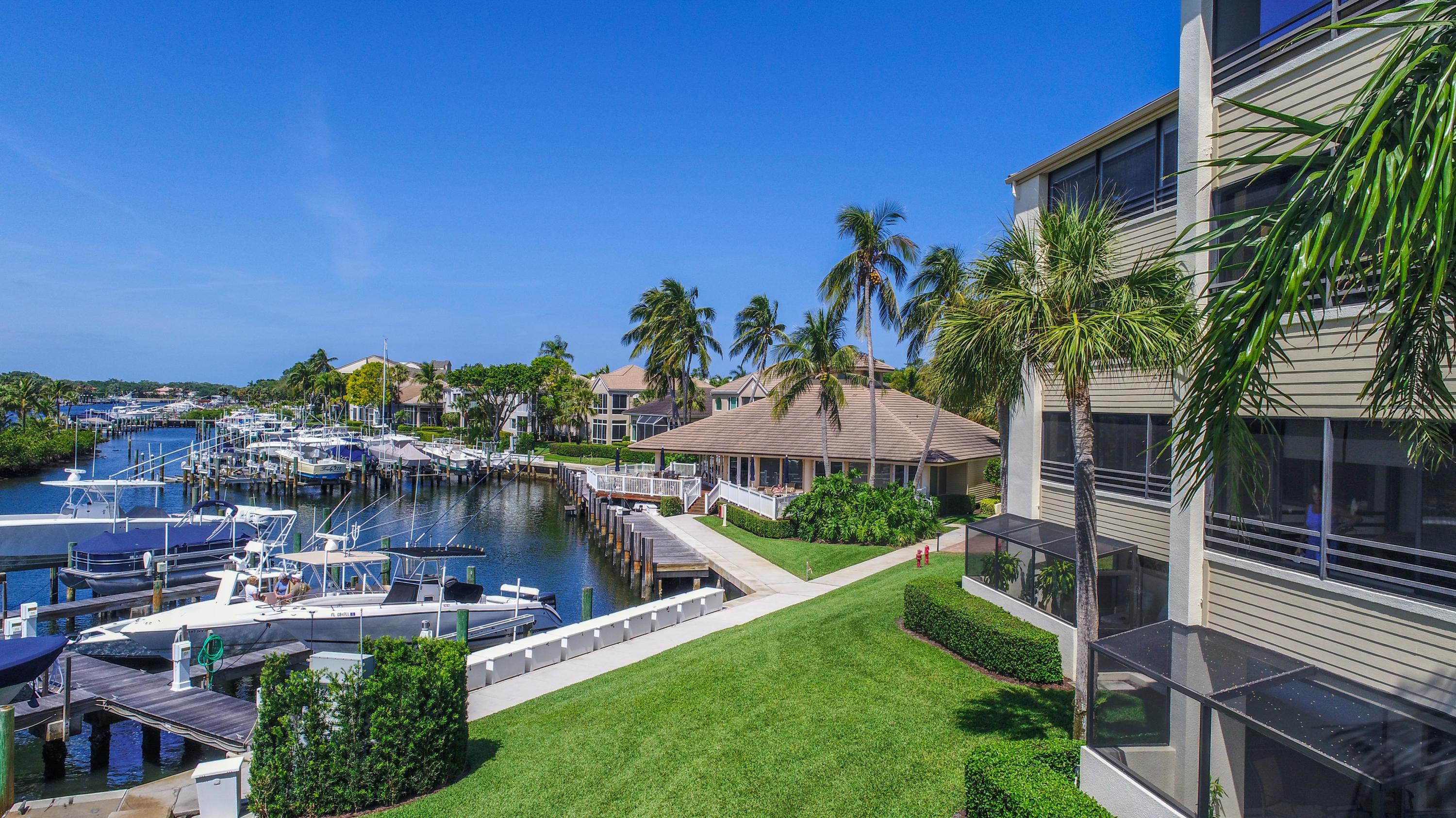 B-9 Oak Harbour Drive Juno Beach, FL 33408 - Photo 12 of 14 a view of a house with a yard and sitting area