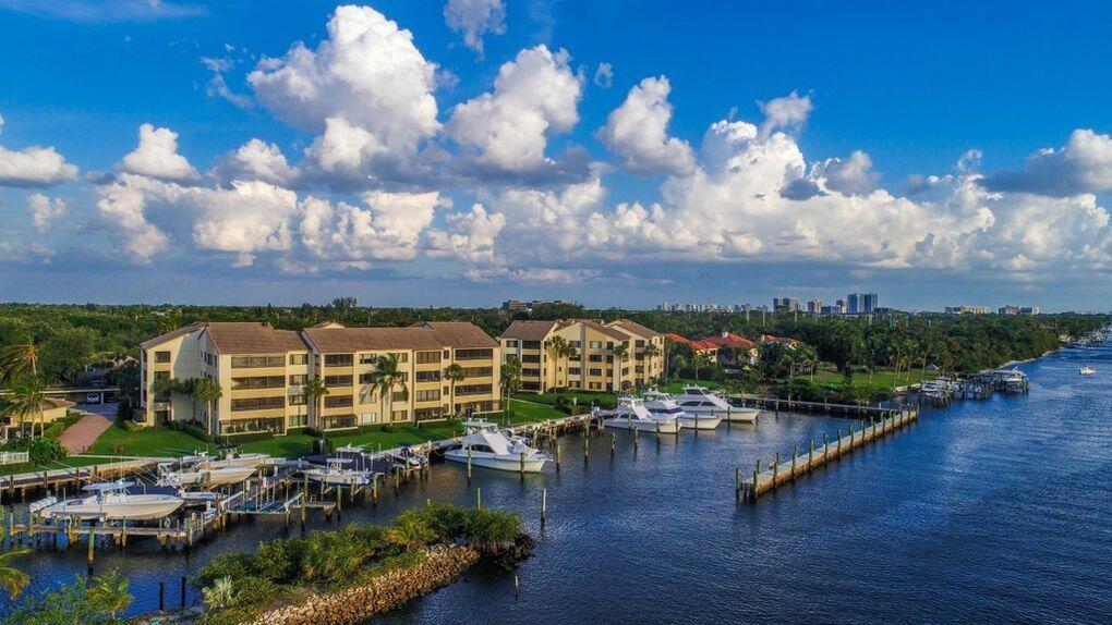B-9 Oak Harbour Drive Juno Beach, FL 33408 - Photo 7 of 14 a view of swimming pool and lake view
