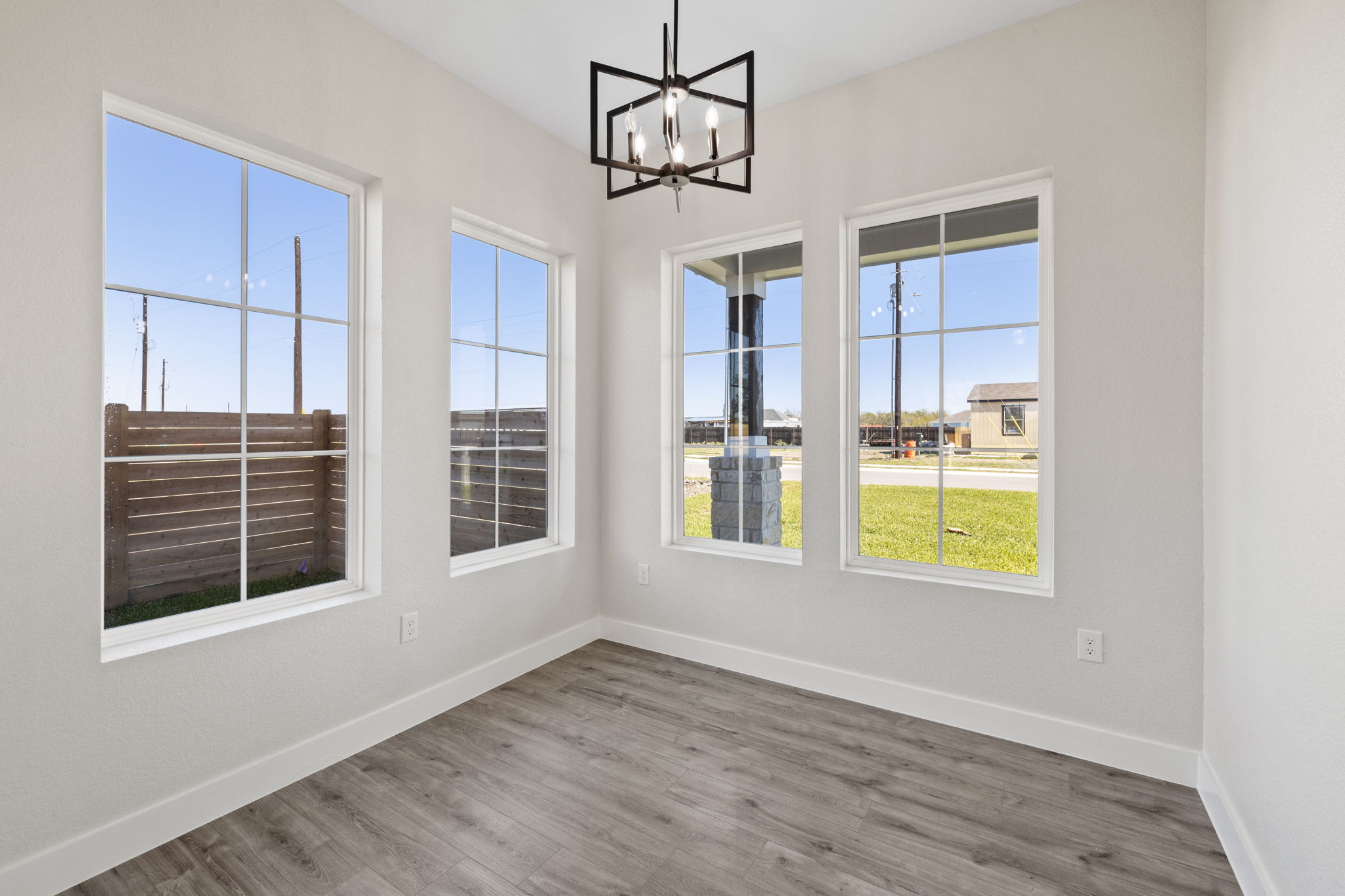 210 Jacaranda Drive Dale, TX 78616 - Photo 15 of 37 a view of an empty room with a window and kitchen view