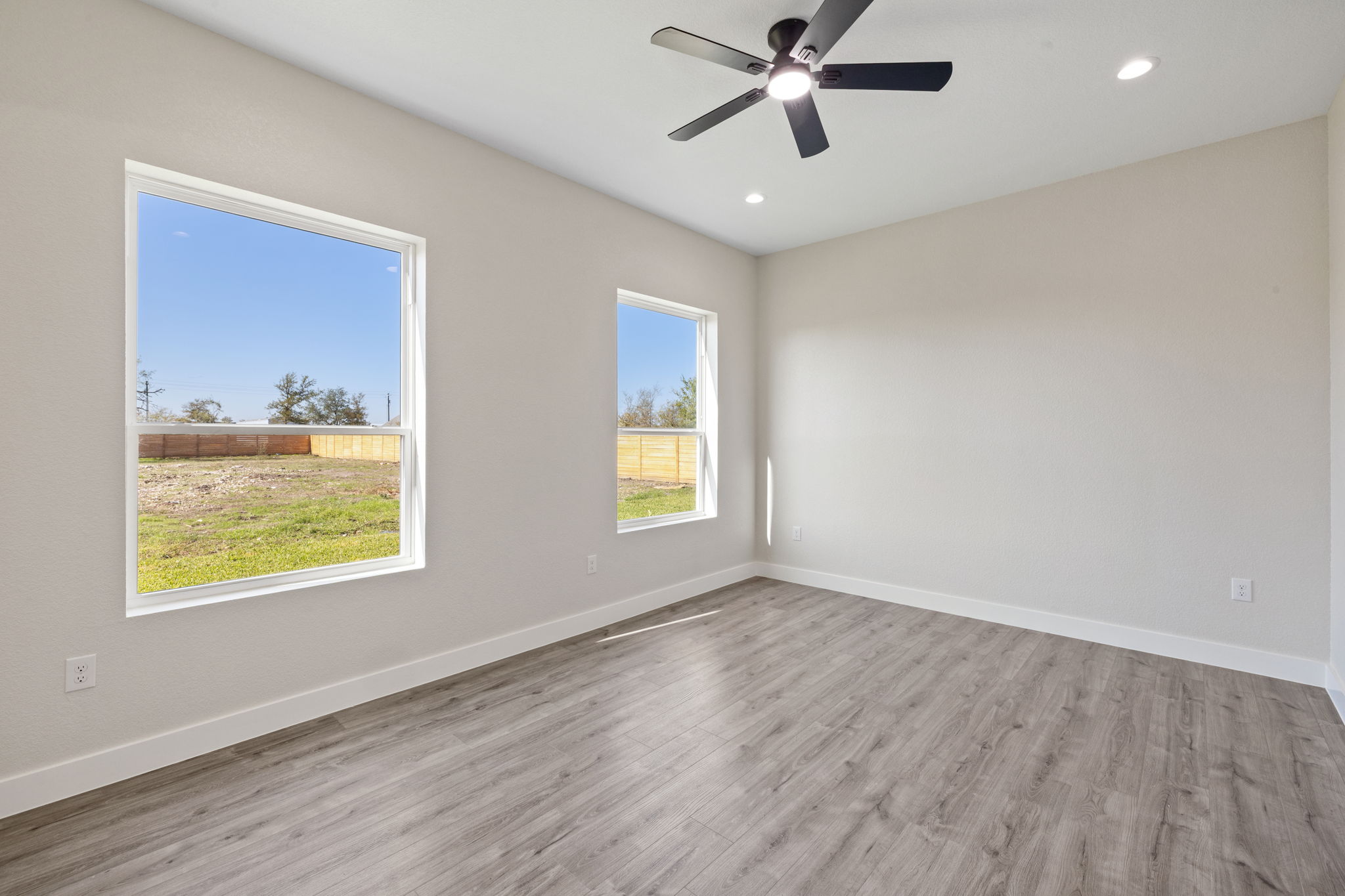 210 Jacaranda Drive Dale, TX 78616 - Photo 27 of 37 a view of an empty room window and wooden floor