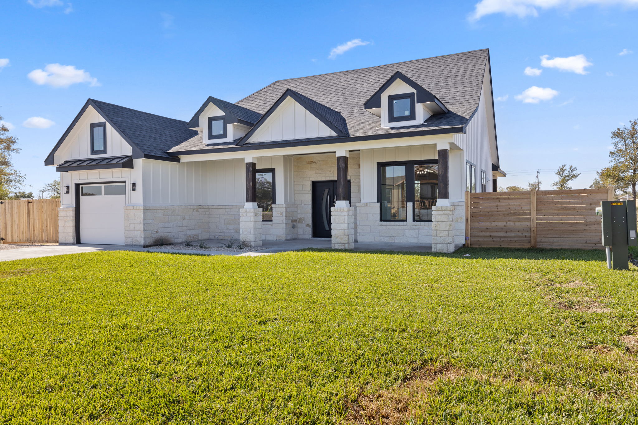 210 Jacaranda Drive Dale, TX 78616 - Photo 3 of 37 a front view of a house with a yard