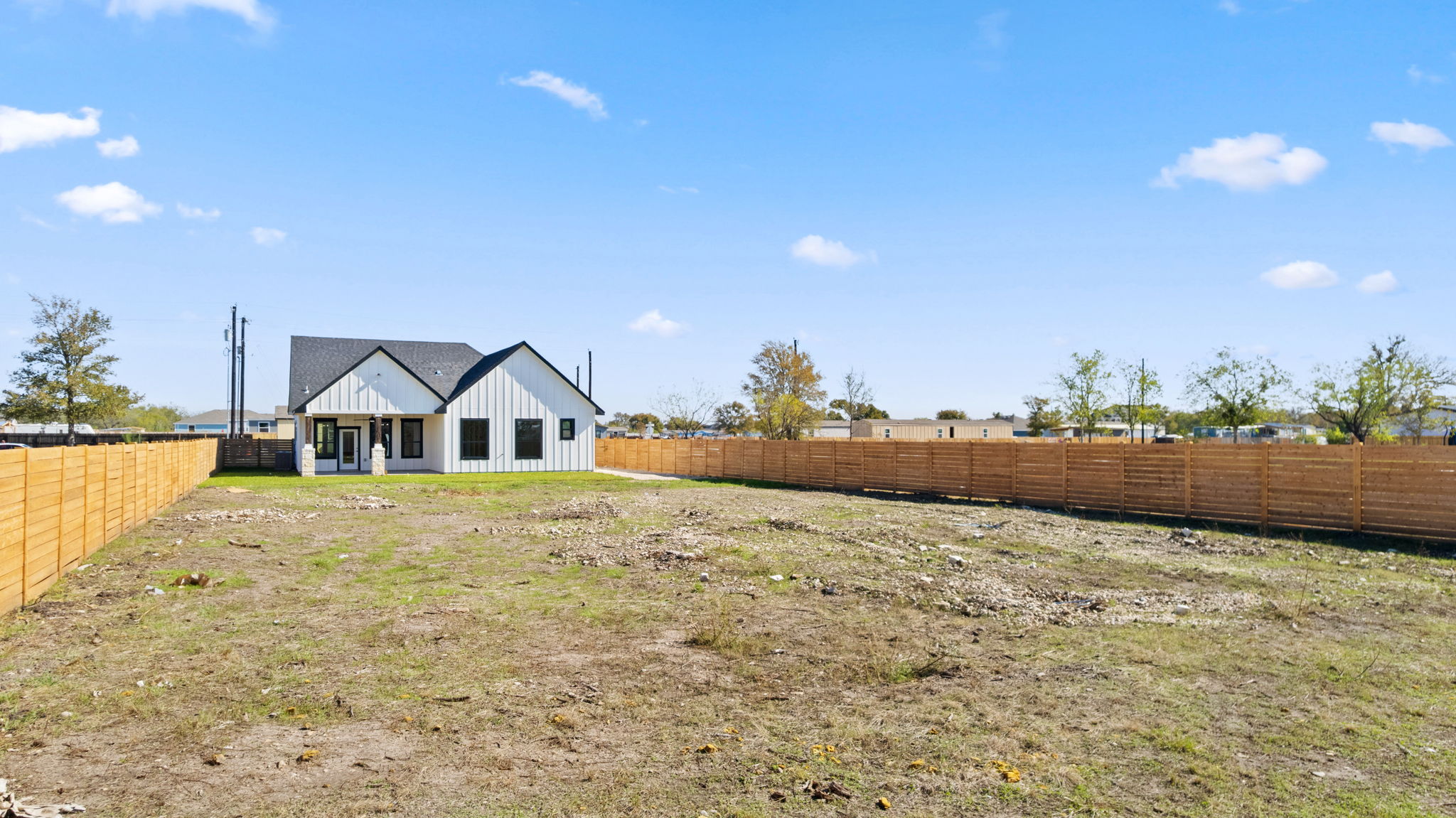 210 Jacaranda Drive Dale, TX 78616 - Photo 35 of 37 a view of an house with backyard and patio