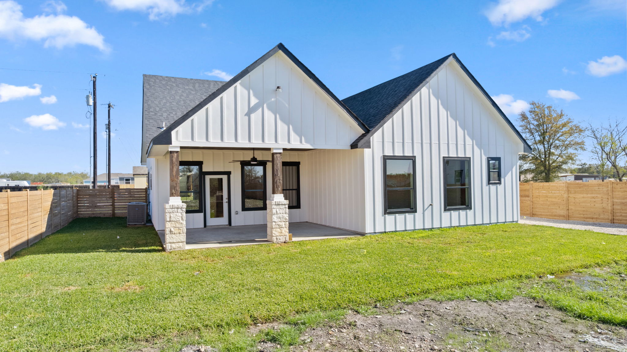 210 Jacaranda Drive Dale, TX 78616 - Photo 37 of 37 a view of a house with a yard and porch