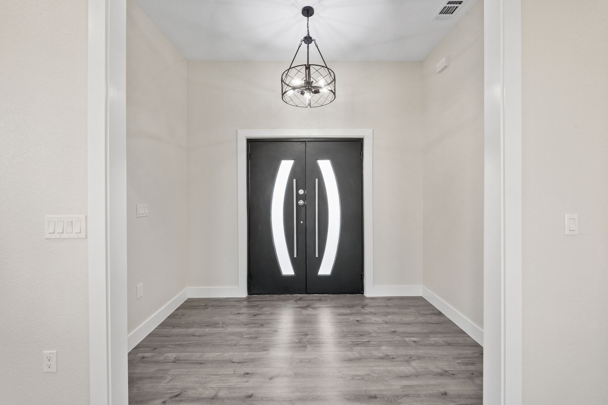 210 Jacaranda Drive Dale, TX 78616 - Photo 6 of 37 a view of a hallway with wooden floor