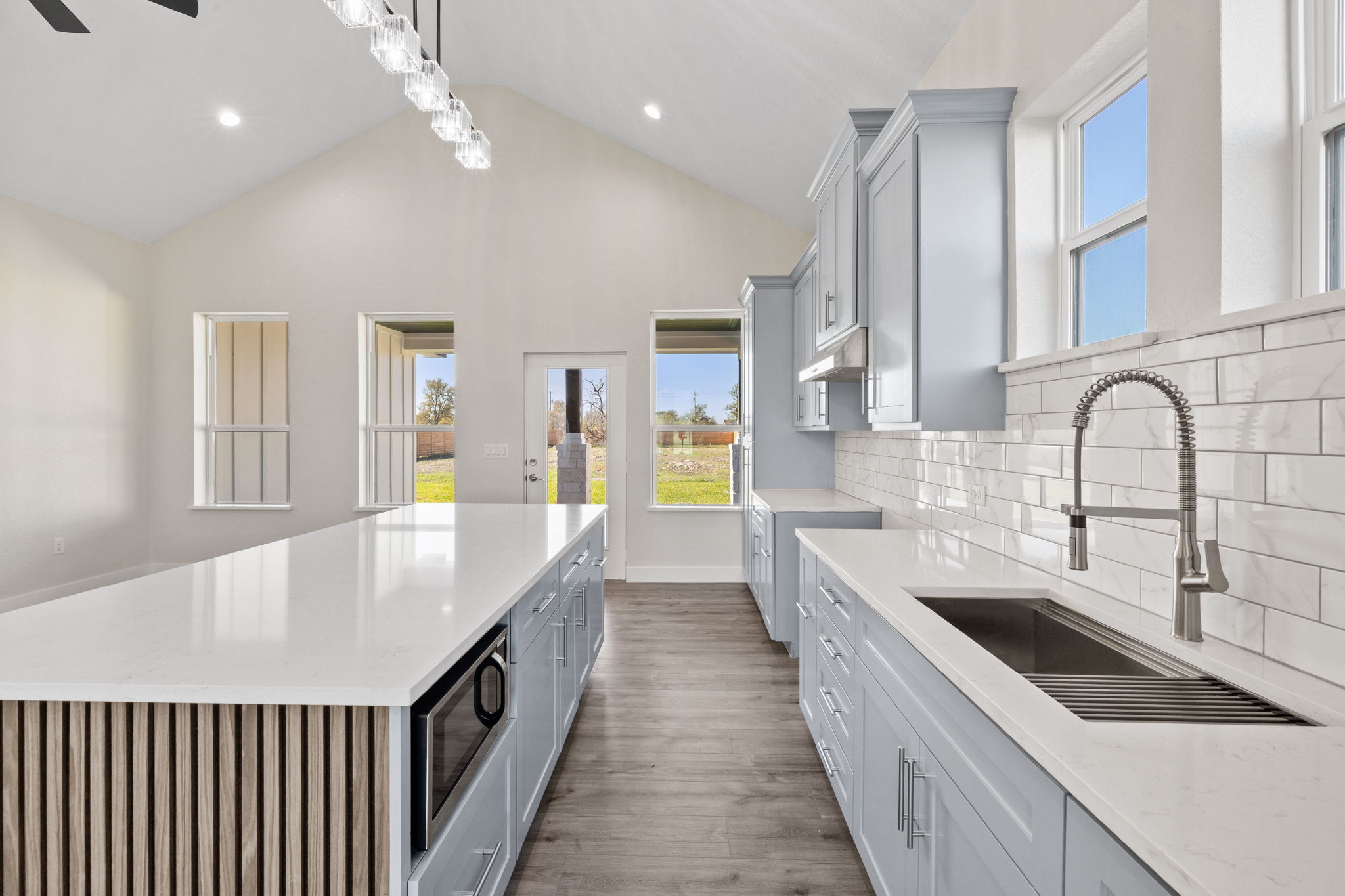 210 Jacaranda Drive Dale, TX 78616 - Photo 10 of 37 a large kitchen with stainless steel appliances lots of counter space and a sink