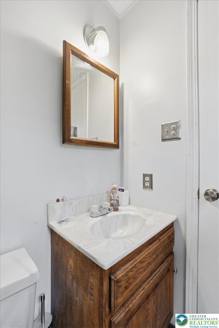 520 Highland Hill Road Jim Thorpe, PA 18235 - Photo 34 of 83 A well-maintained bathroom vanity with a spacious countertop and classic wood cabinetry.