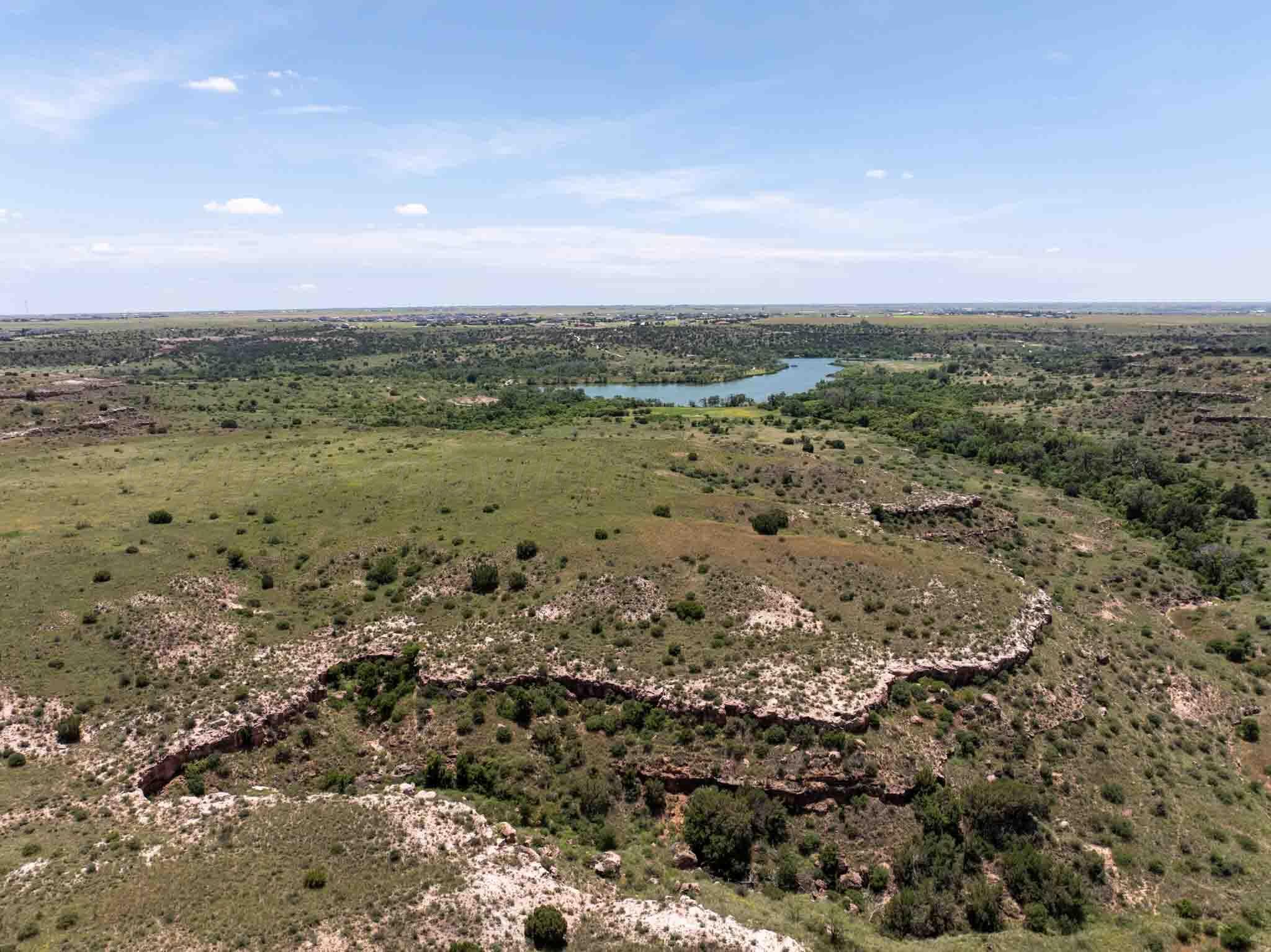 35.22 Jackson Ranch Road Canyon, TX 79015 - Photo 9 of 19 a view of a field with an ocean