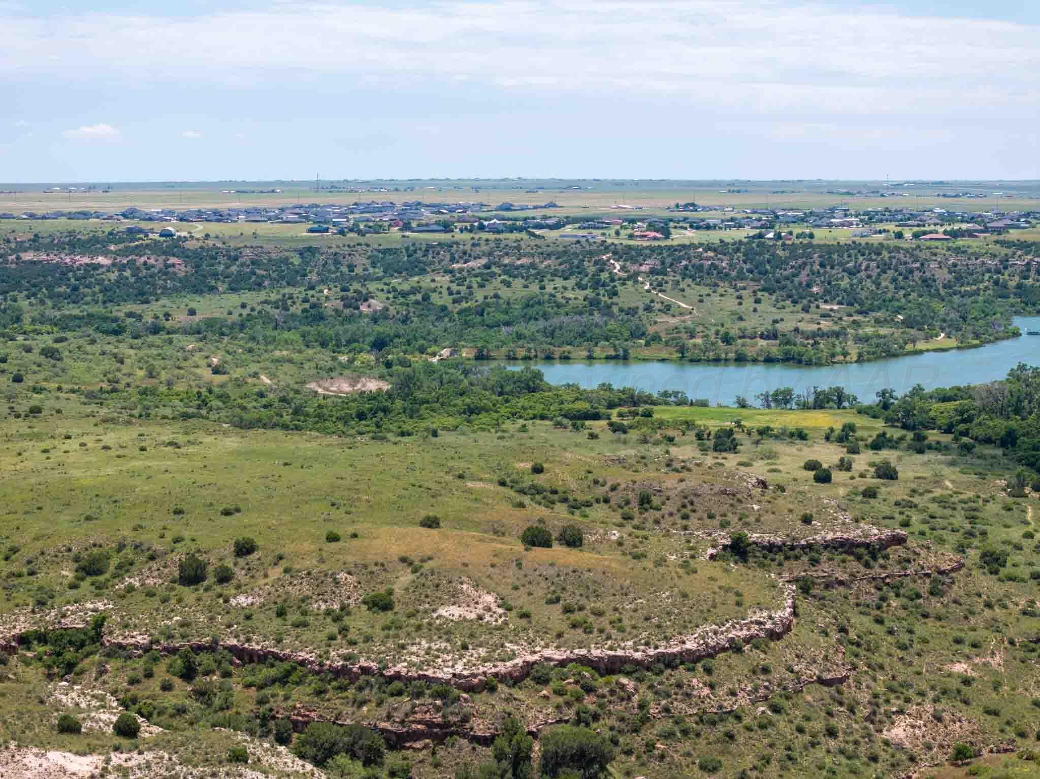 35.22 Jackson Ranch Road Canyon, TX 79015 - Photo 10 of 19 a view of a field with mountains in the background