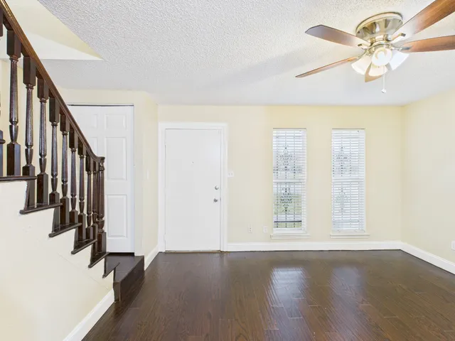 a bathroom with a sink mirror vanity and toilet