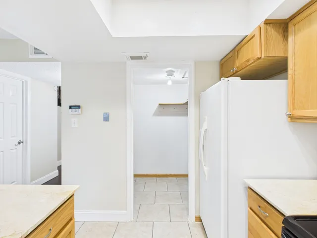 a view of a kitchen from the hallway