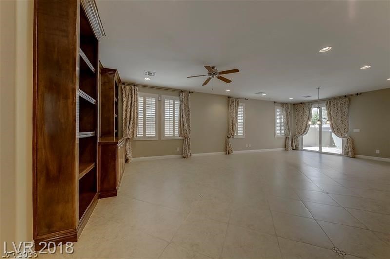 3144 Whitfeild Avenue Henderson, NV 89044 - Photo 12 of 55 Built-in shelving and ample natural illumination enhance this generous living space.