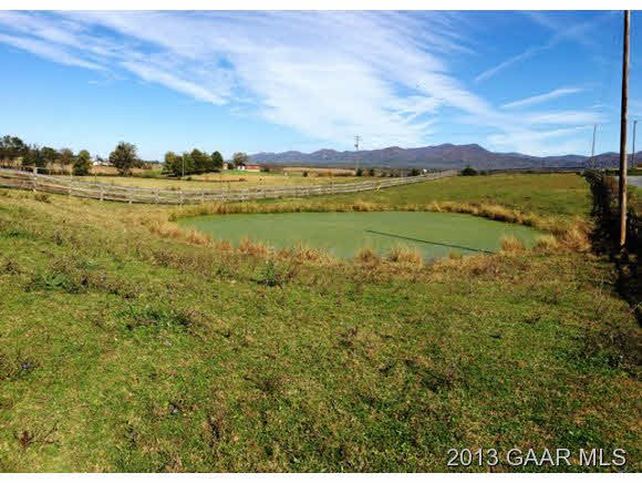 1044 Humbert Road Crimora, VA 24431 - Photo 12 of 21 a view of a lake with houses in the back