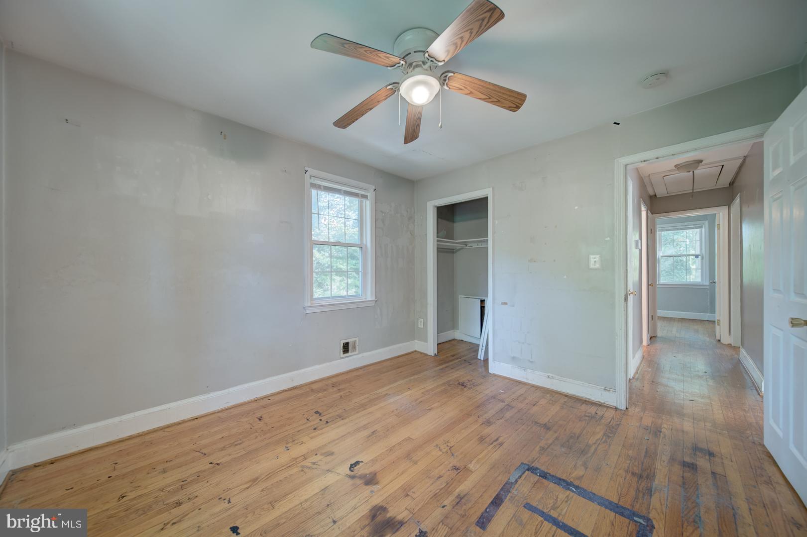 802 Modoc Lane Oxon Hill, MD 20745 - Photo 12 of 34 wooden floor in an empty room with a window