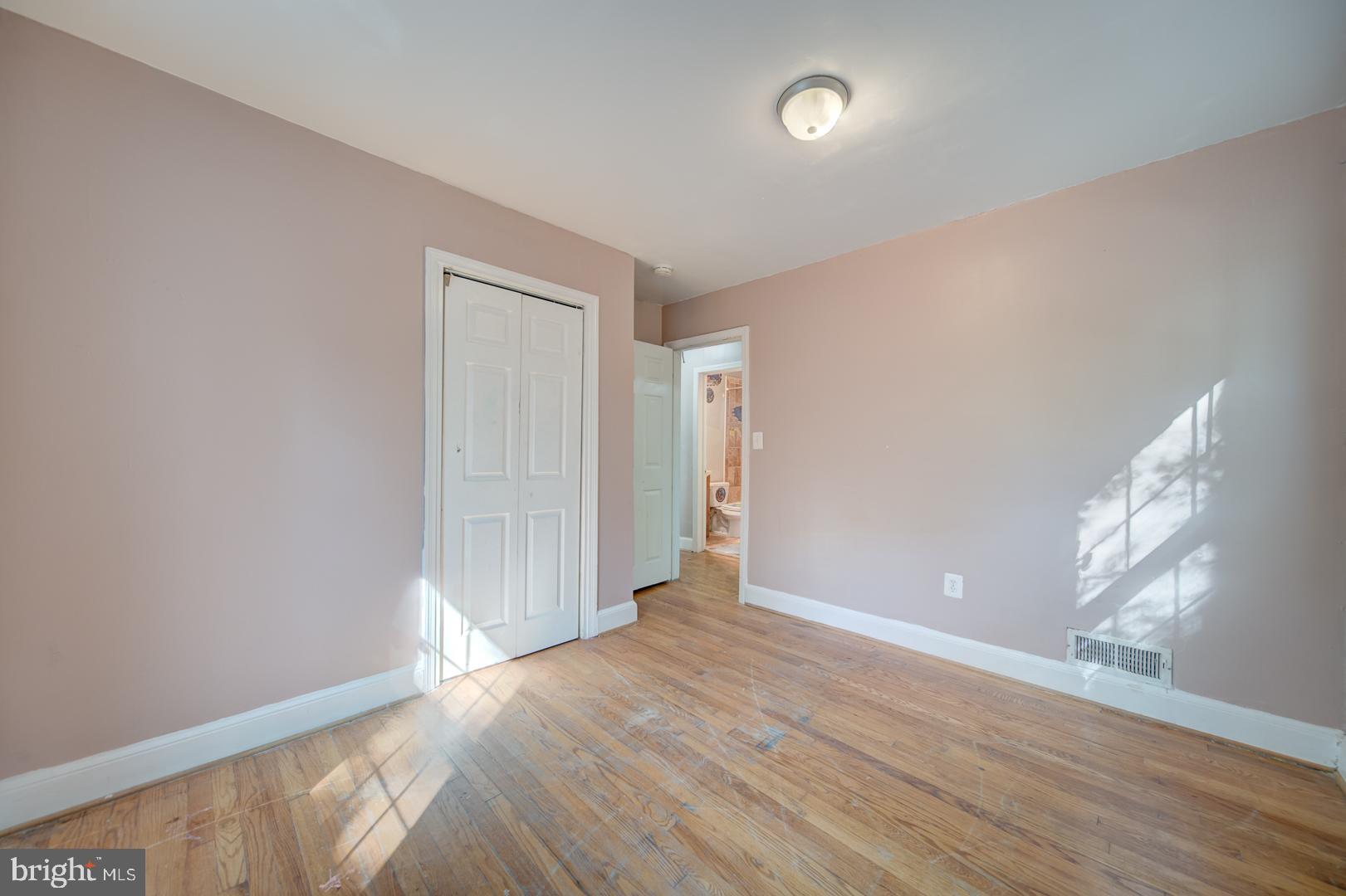 802 Modoc Lane Oxon Hill, MD 20745 - Photo 21 of 34 wooden floor in an empty room