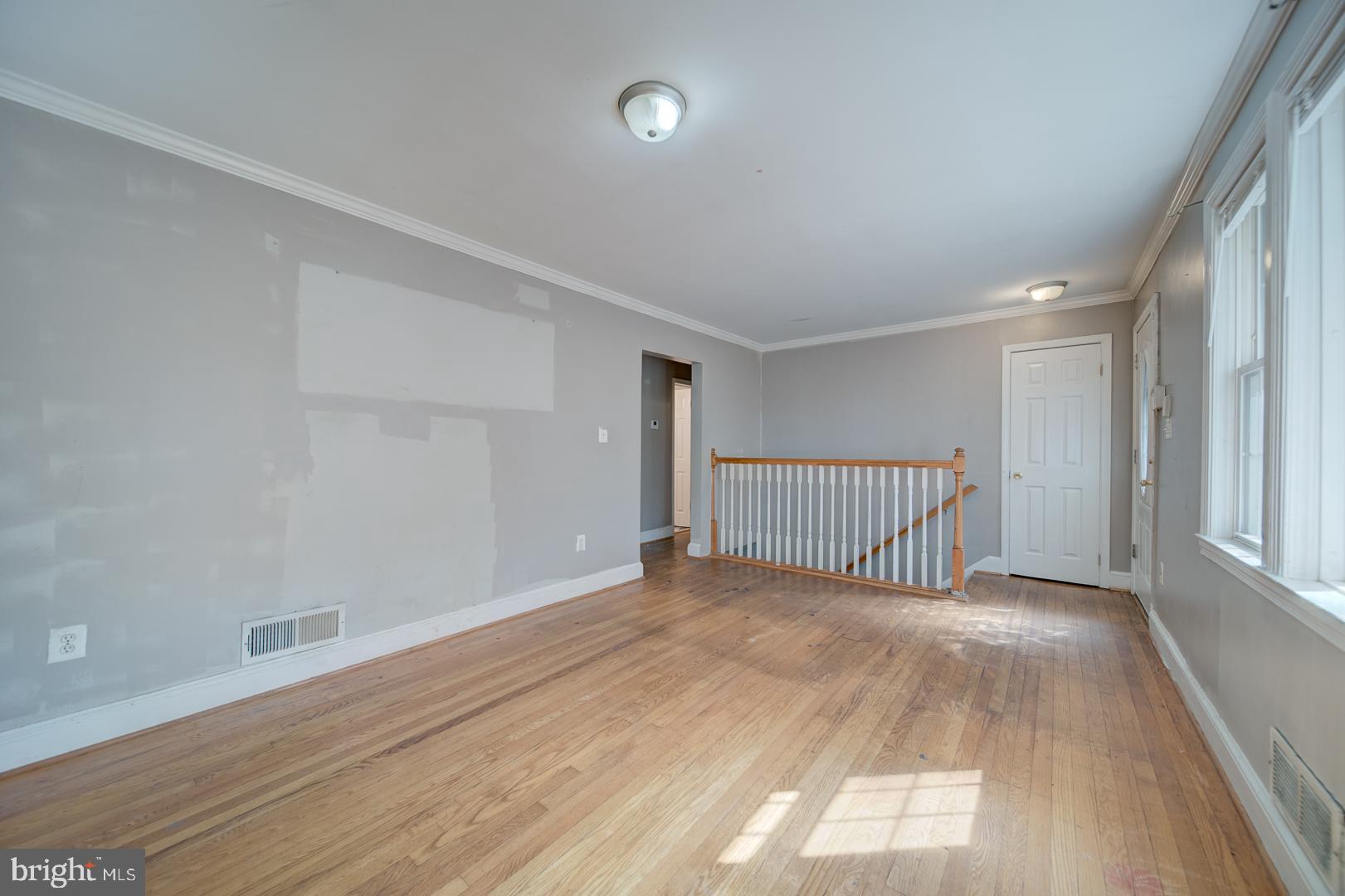802 Modoc Lane Oxon Hill, MD 20745 - Photo 9 of 34 wooden floor in an empty room with a window