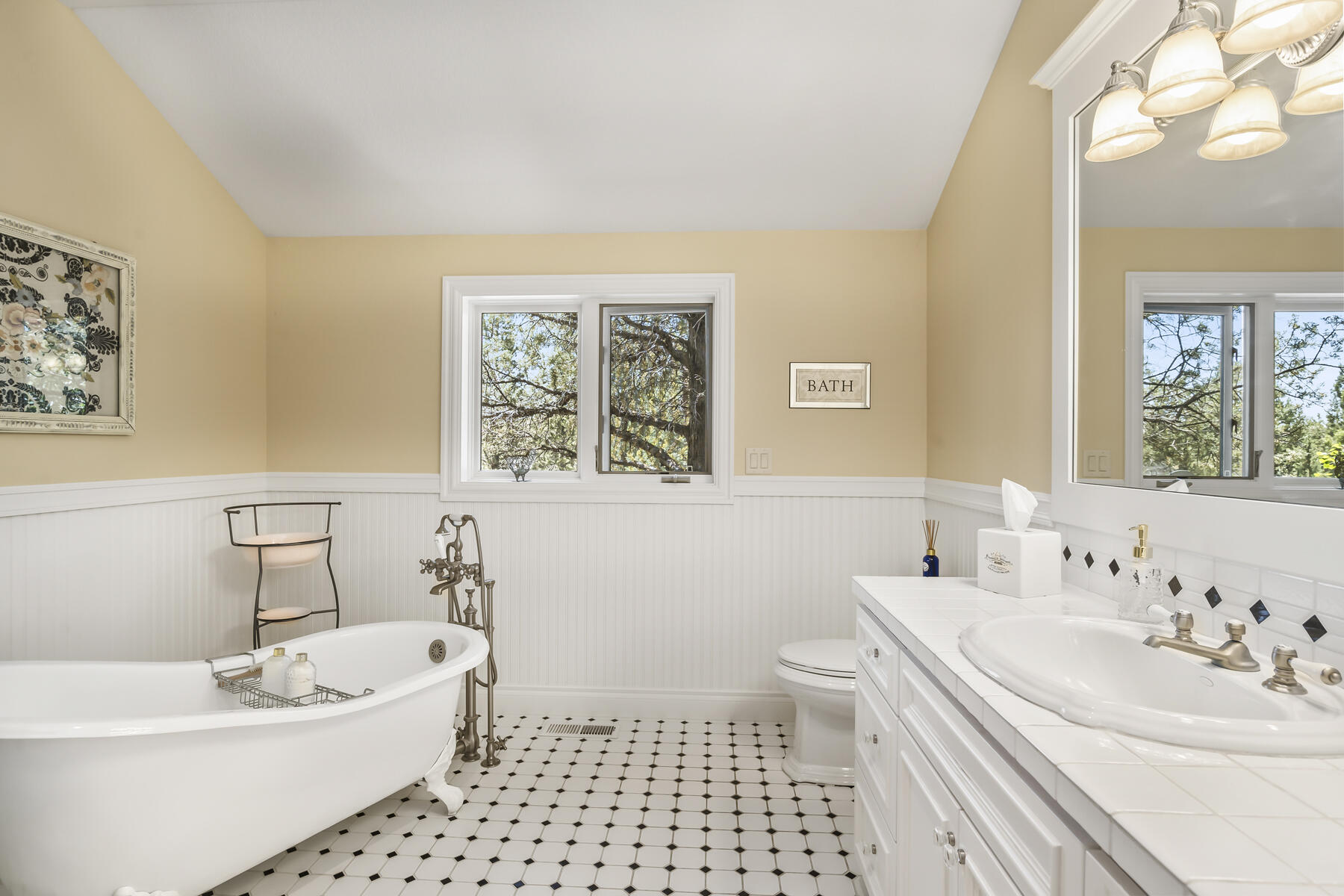 61445 Gosney Road Bend, OR 97702 - Photo 48 of 83 a bath room with a sink a toilet and a bath tub