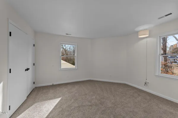 an empty room with windows