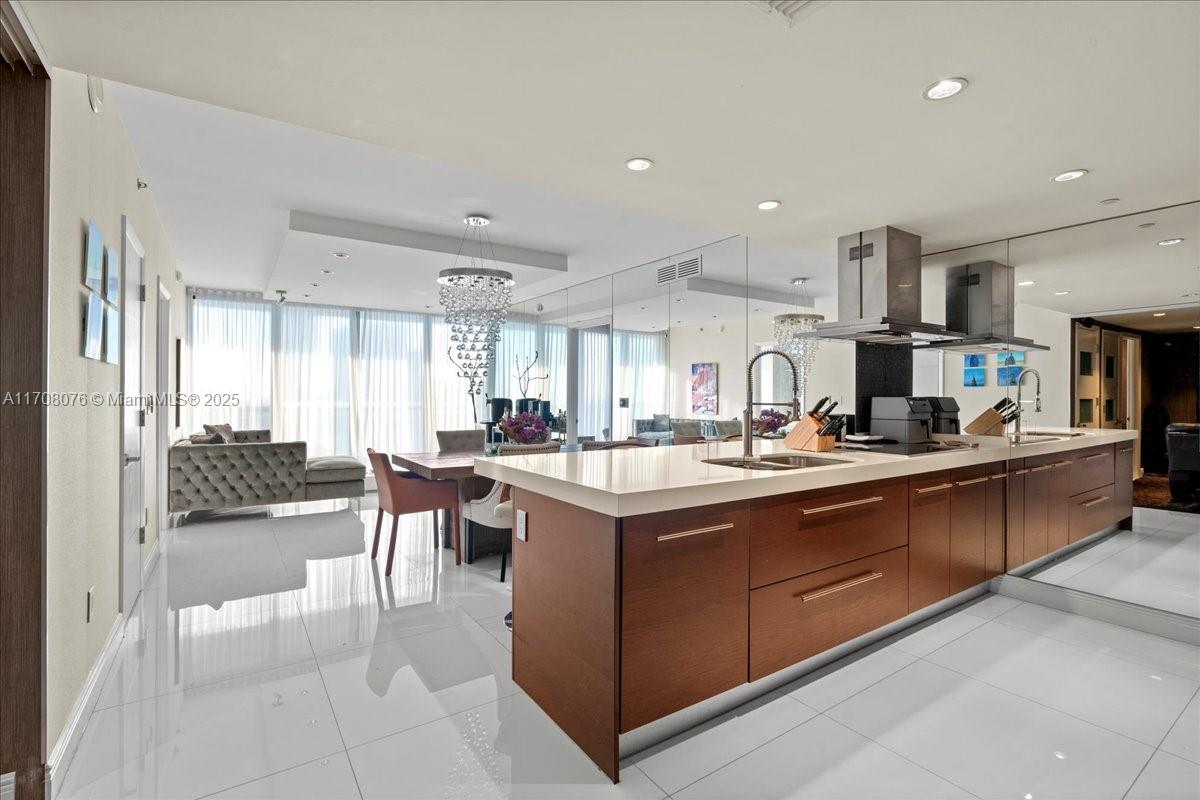 495 Brickell Avenue, Unit 4403 Miami, FL 33131 - Photo 3 of 40 a kitchen with lots of counter top space and living room