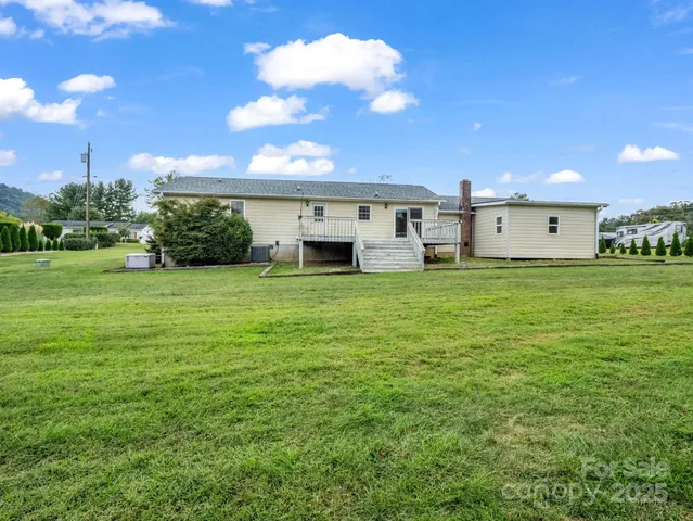 an aerial view of a house with outdoor space