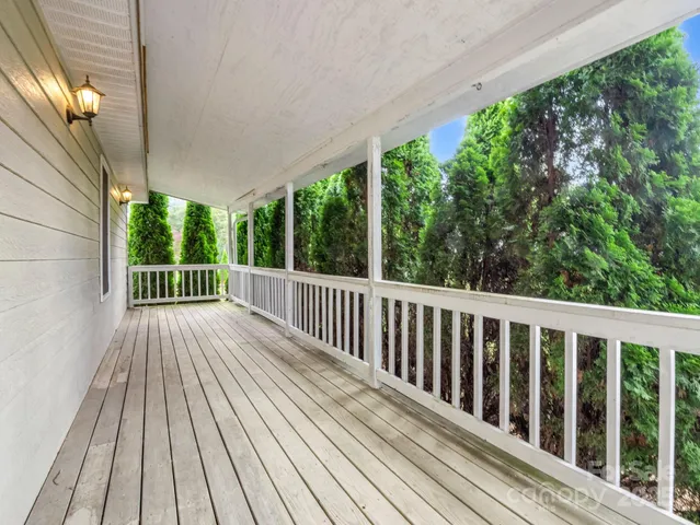 a view of balcony with wooden floor