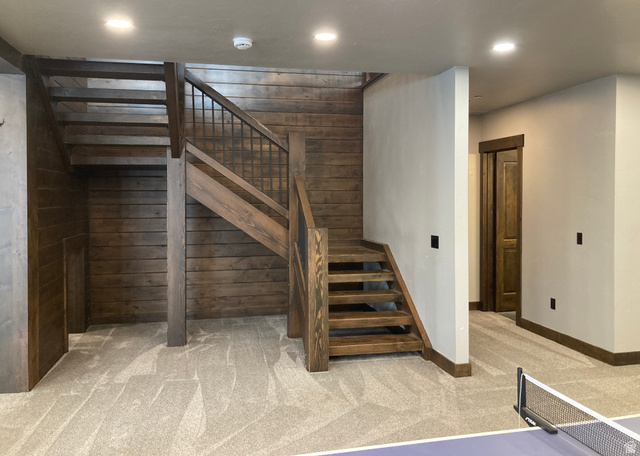 259 Meadow Drive Springville, UT 84663 - Photo 46 of 62 Staircase with carpet, wooden walls, and recessed lighting