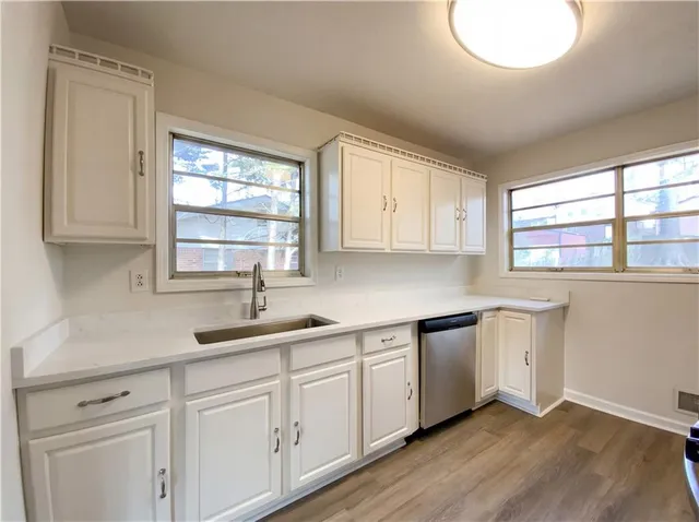a kitchen with sink and window