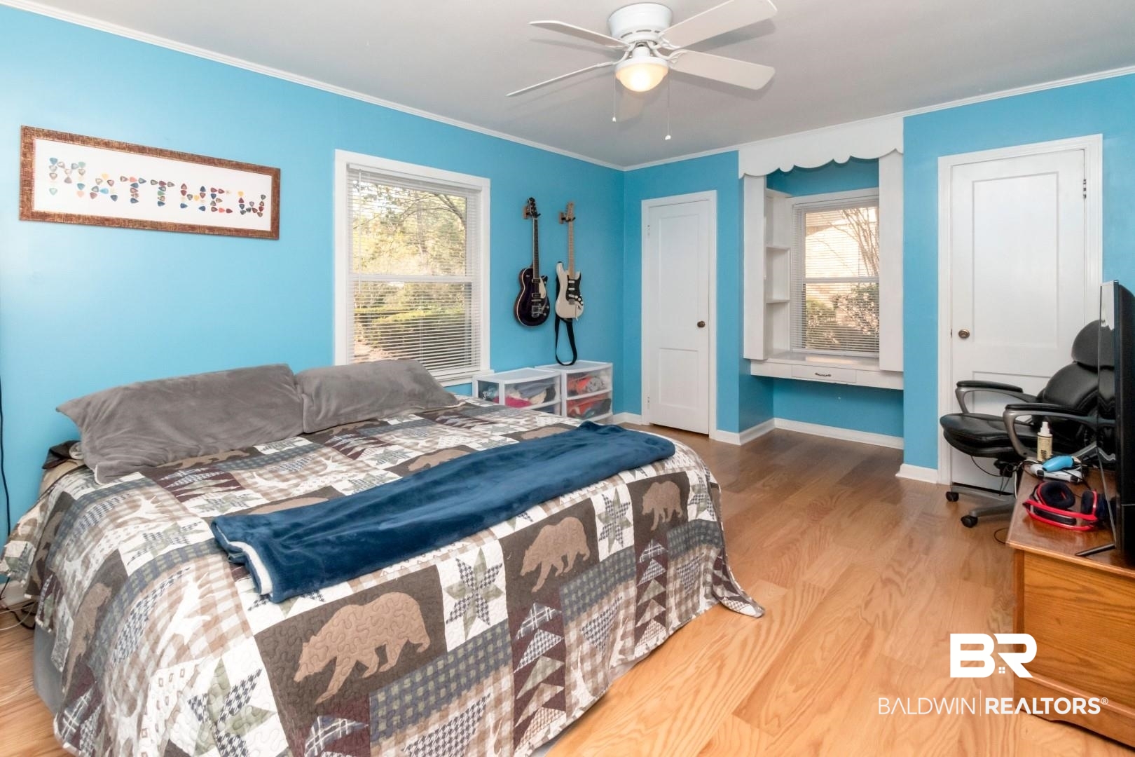 1321 Rainbow Drive West Mobile, AL 36693 - Photo 33 of 48 Bedroom featuring multiple windows, ornamental molding, hardwood / wood-style flooring, and ceiling fan