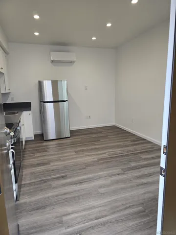 a view of kitchen and wooden floor