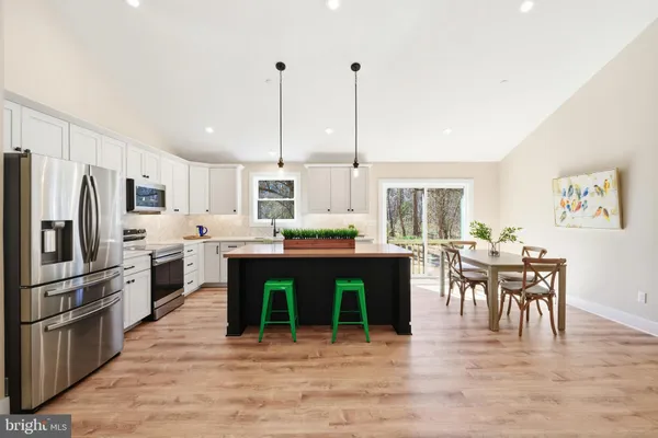 a kitchen with a sink cabinets and window