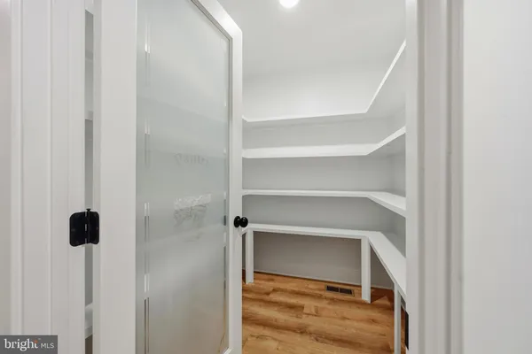 a view of a bathroom from a hallway