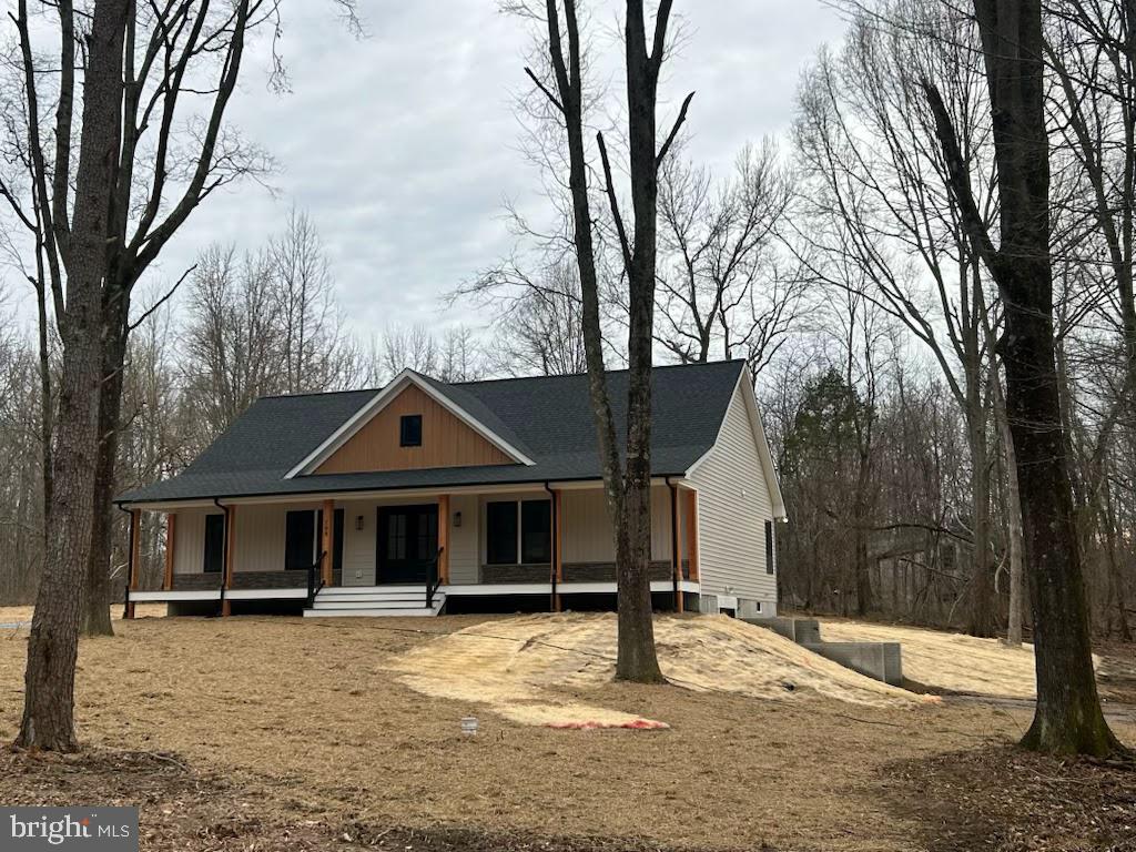 108 Springbrook Lane Millington, MD 21651 - Photo 3 of 48 a front view of a house with a yard covered in snow