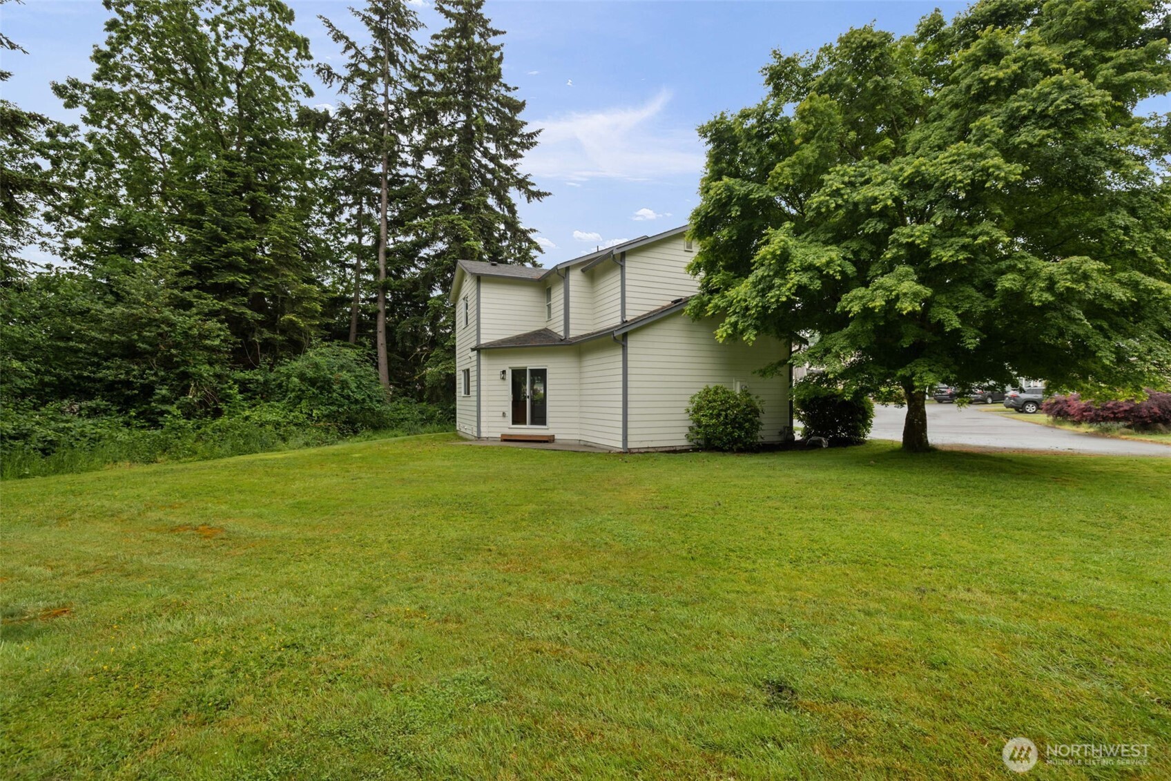 3560 Courtyard Lane Bremerton, WA 98310 - Photo 24 of 26 a view of a house with a yard