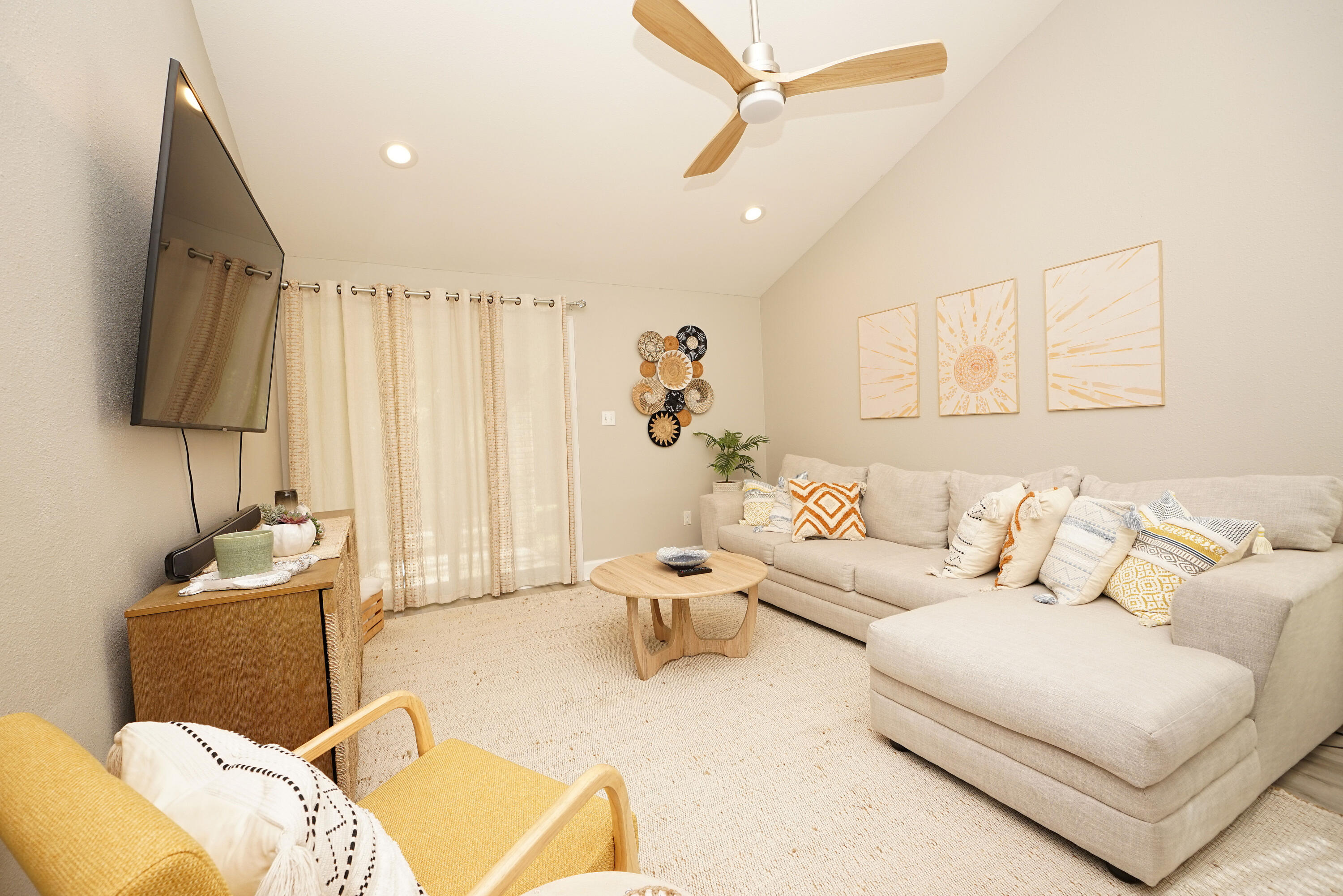 1503 Green Acres Boulevard, Unit E Fort Walton Beach, FL 32547 - Photo 12 of 25 a living room with furniture and a flat screen tv