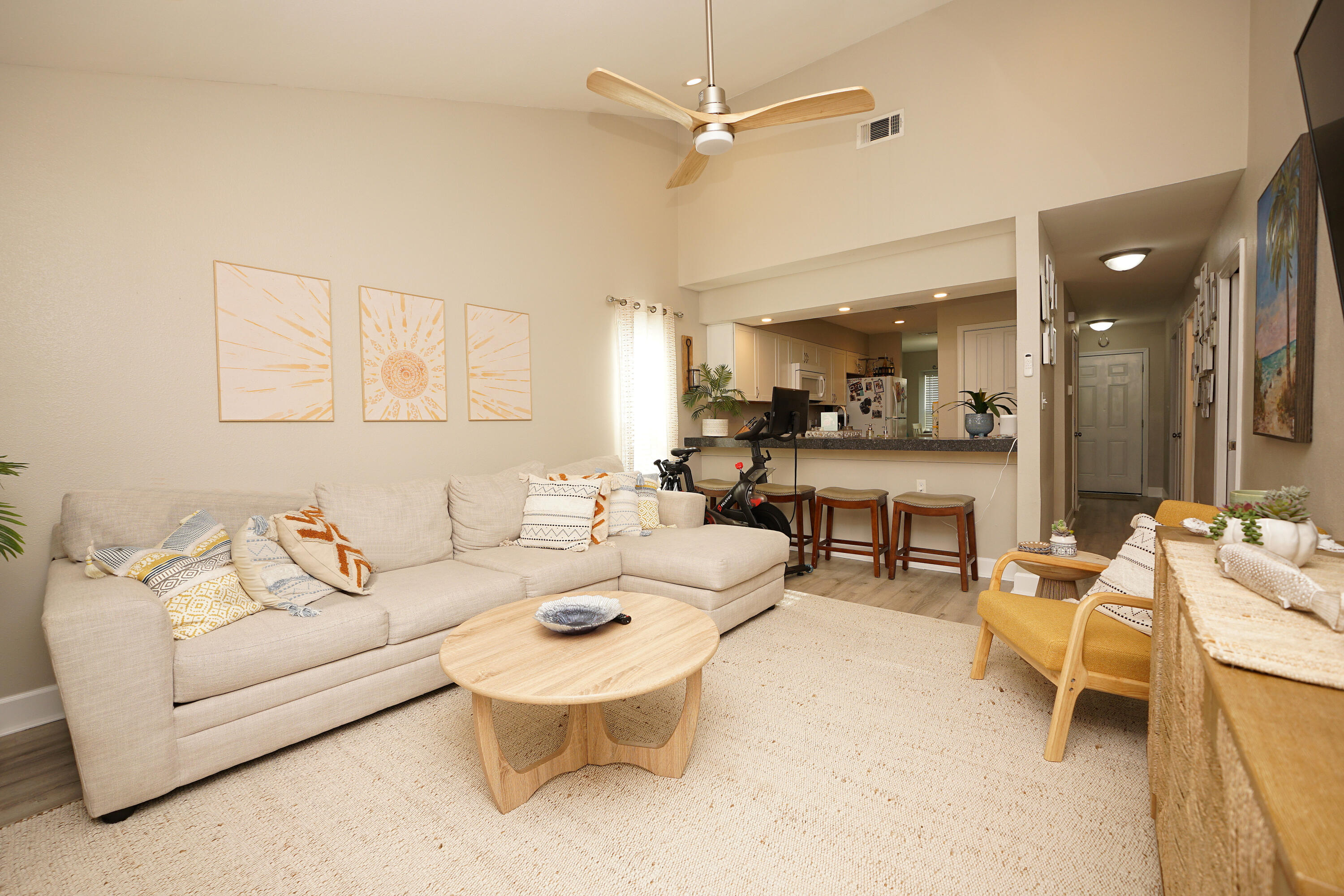 1503 Green Acres Boulevard, Unit E Fort Walton Beach, FL 32547 - Photo 15 of 25 a living room with furniture and a dining table with kitchen view