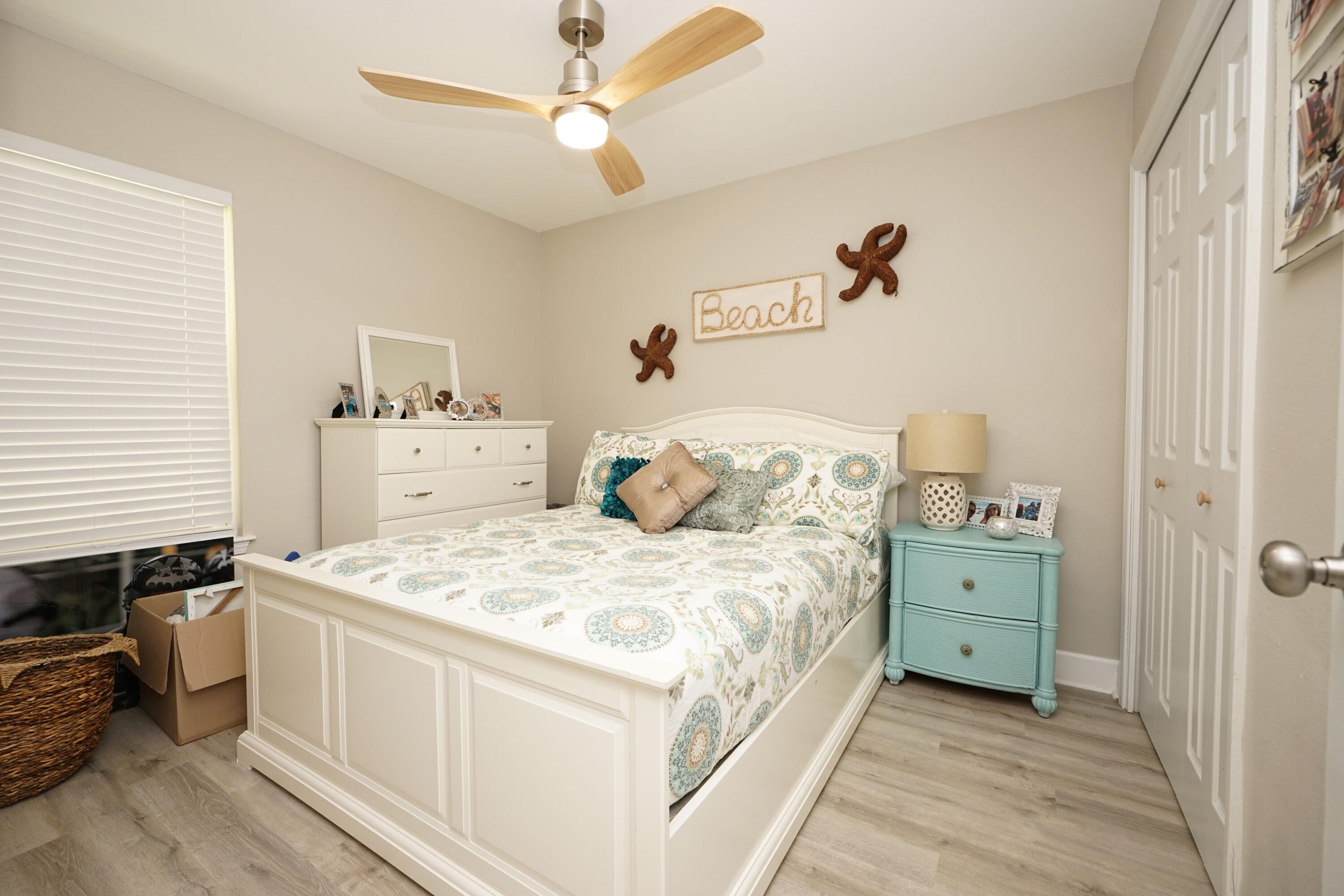 1503 Green Acres Boulevard, Unit E Fort Walton Beach, FL 32547 - Photo 18 of 25 a bedroom with a bed and a chandelier